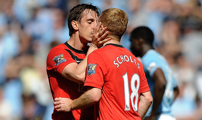 MANCHESTER, ENGLAND - APRIL 17:  Paul Scholes of Manchester United is kissed by team mate Gary Neville after scoring the winning goal during the Barclays Premier League match between Manchester City and Manchester United at the City of Manchester Stadium on April 17, 2010 in Manchester, England.  (Photo by Laurence Griffiths/Getty Images) *** Local Caption *** Paul Scholes;Gary Neville