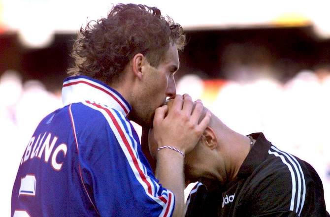 French defender Laurent Blanc (L) kisses French goalkeeper Fabien Barthez after scoring the first golden goal in World Cup history to give France a 1-0 win 28 June at the Felix Bollaert stadium in Lens, northern France, after the 1998 Soccer World Cup second round match between France and Paraguay.   (ELECTRONIC IMAGE)    AFP PHOTO (Photo credit should read PHILIPPE HUGUEN/AFP/Getty Images)